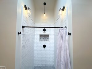 Combined shower/bathtub, hair dryer, towels, soap