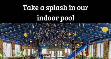 This is IT Cabin with a hot tub, fire pit, & indoor pool!