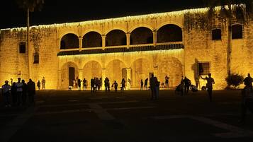 A historic building with multiple arches and a courtyard.