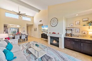 Smart TV, fireplace, books, stereo