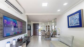 Comfort Apartment | Living area | 50-inch Smart TV with cable channels, TV, Netflix