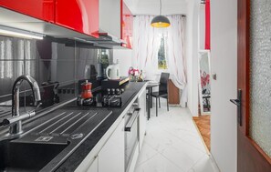 Fridge, oven, coffee/tea maker, cookware/dishes/utensils