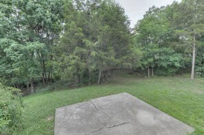 Surrounded by lush trees, this outdoor space offers a serene escape.