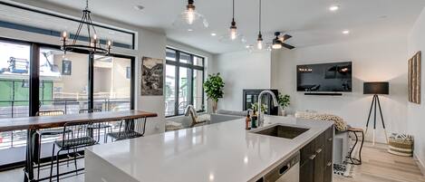 Deluxe Condo | Private kitchen | Full-size fridge, microwave, oven, stovetop