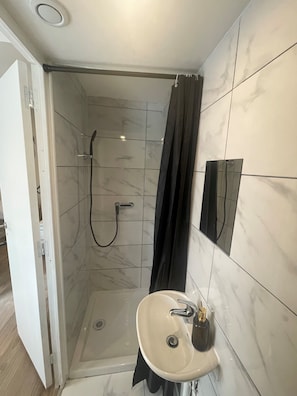 Shower, towels, soap, toilet paper