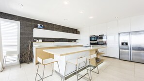 Enjoy dining or socializing at the kitchen island with appliances.