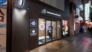 A restaurant with a dark facade and illuminated signage. - Rembrandt Cabin and Spa Shimbashi - Caters to Men (Tokyo)