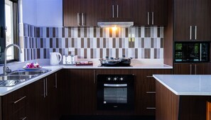 Full-sized fridge, microwave, oven, stovetop - Coastal Suites (Sigatoka)