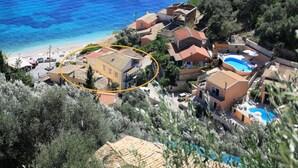 A coastal property with multiple buildings, a swimming pool, and a beach. - Jasmin in Katavolos With 1 Bedrooms and 1 Bathrooms (Corfu)