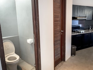 A modern bathroom with a toilet and a sink.