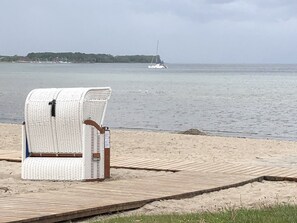 On the beach, sun-loungers