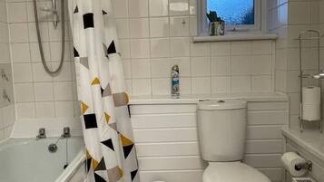 Combined shower/tub, hair dryer, towels, soap