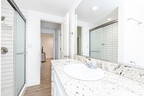 Shower, hair dryer, towels, toilet paper