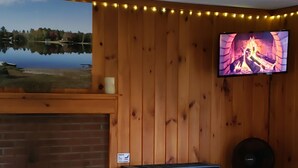 Romantic Cabin | Living area | 32-inch Smart TV with digital channels, TV, streaming services - The Cottages On Mirror Lake (Whitefield)