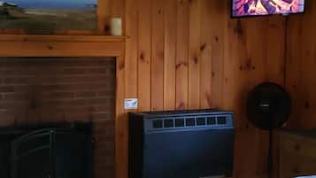Romantic Cabin | Living area | 32-inch Smart TV with digital channels, TV, streaming services