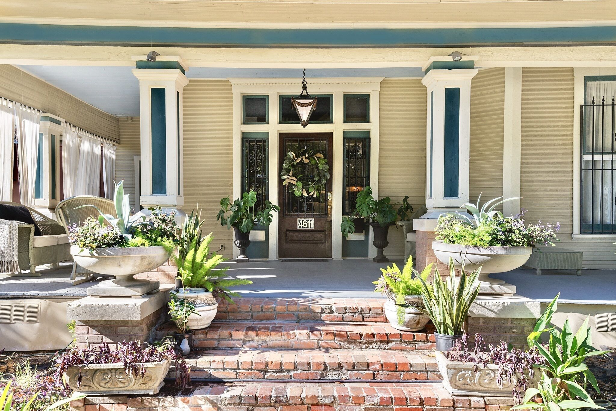 A building entrance with a brick pathway leading to a door marked "4611".