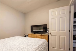1 bedroom, desk, iron/ironing board, travel crib