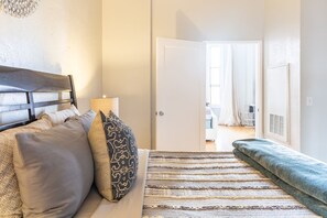 1 bedroom, desk, iron/ironing board, travel crib