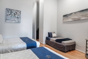1 bedroom, desk, iron/ironing board, travel crib
