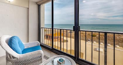 Enjoy horizon views and community pool at 2BR/2BA oceanfront condo