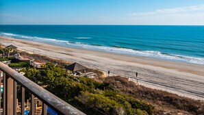 A beach with a wooden walkway, a gazebo, and a playground. - Modern 2BR/2BA condo unit w/ community pool and oceanfront view (Wrightsville Beach)