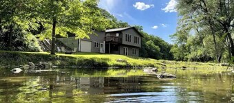 Timber Coulee Creek in backyard, king size bed, grill on deck,  large garage.