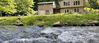 Timber Coulee Creek in backyard, king size bed, grill on deck,  large garage.