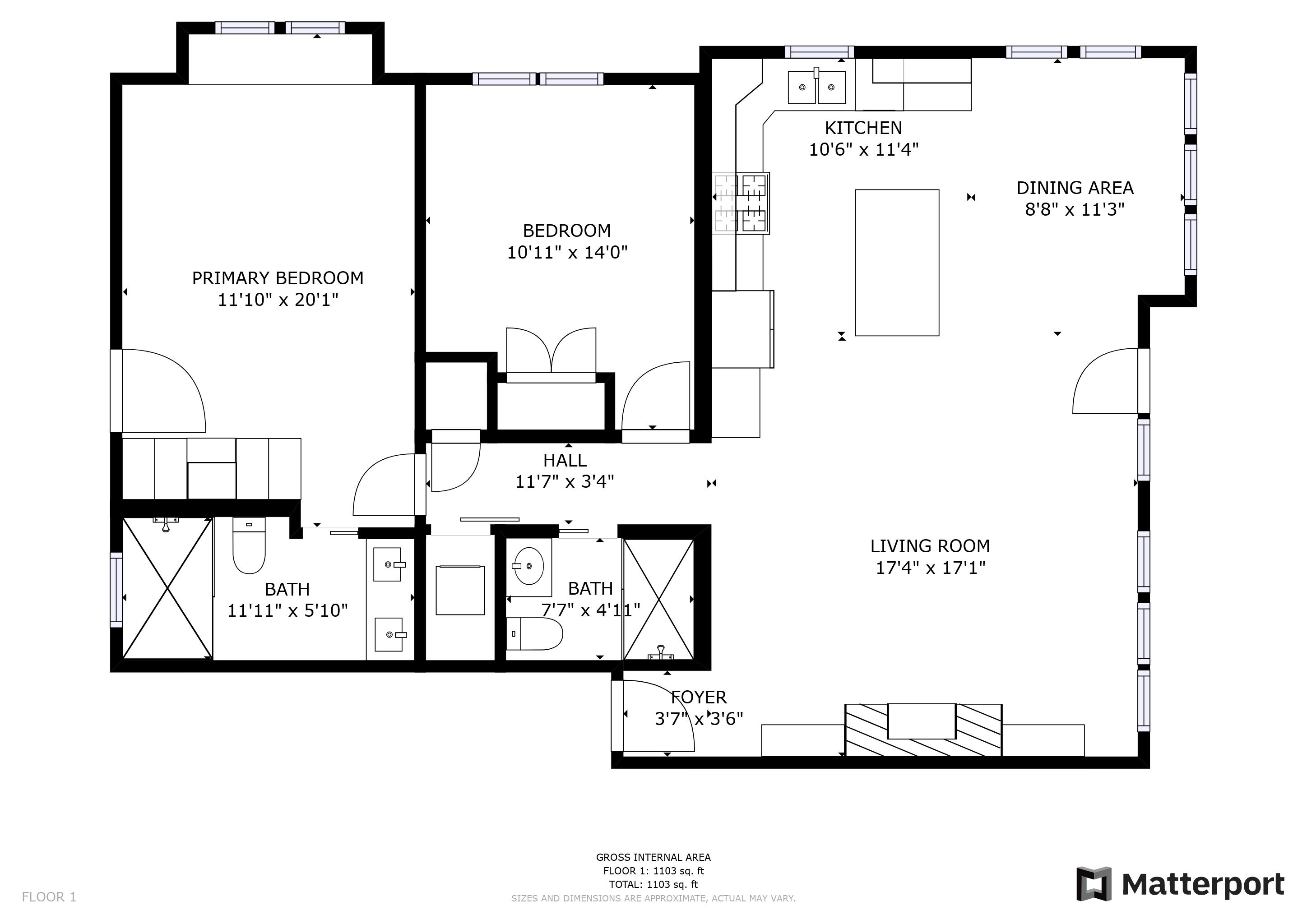 Plan d’étage d’un appartement d’une chambre, comprenant une chambre principale, une plus petite chambre, une cuisine, un coin repas, un salon, deux salles de bain, un hall d’entrée et un couloir.
