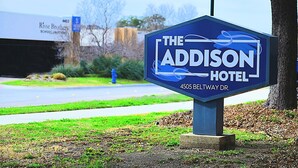 A sign for The Addison Hotel at 4505 Beltway Dr. - The Addison Hotel, SureStay Collection by Best Western (Addison)