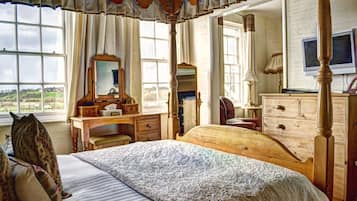 Desk, iron/ironing board, bed sheets