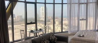 Apartment with a city view. Manama, Seef.