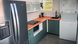 A compact kitchen with a refrigerator, microwave, sink, and a built-in oven. - 3 BR Residence w. Private Terrace + Rooftop (San Juan)