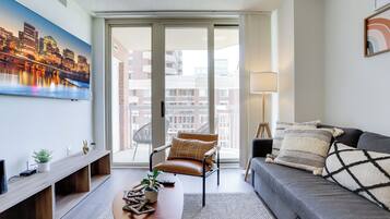 City Apartment, 1 Bedroom, City View | Living area | 50-inch plasma TV with cable channels, TV