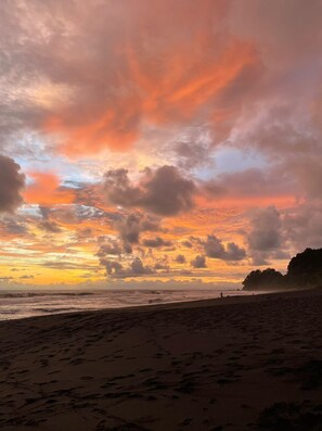 On the beach, black sand