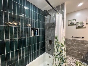 Bathtub, hair dryer, towels, soap