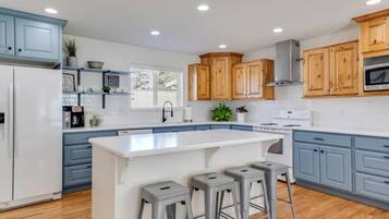 Kitchen with a big island and seating for four