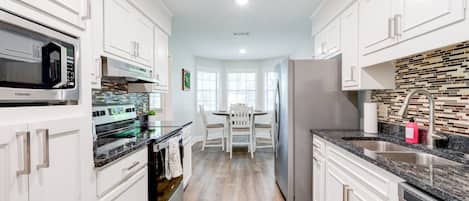 Coffee/tea maker, fridge, microwave, oven