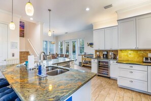 Fridge, microwave, oven, stovetop - Turtle Cove: 4 Houses to Beach, Elevator, Pool, by Anna Maria Life Vacation Rentals (Holmes Beach)
