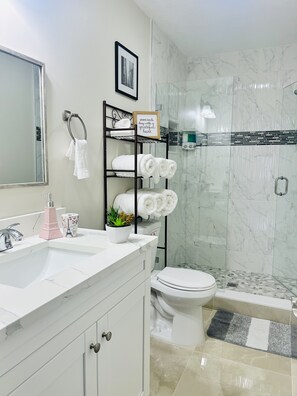 Shower, hair dryer, towels, soap