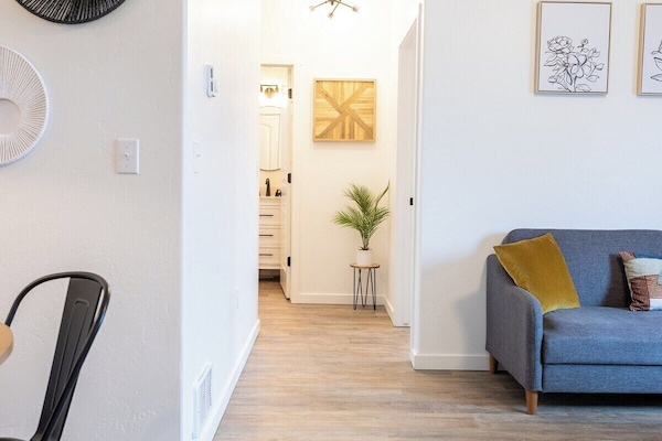 The large living room window provides plenty of warm natural light