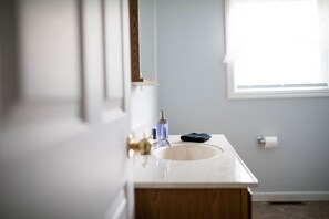 Combined shower/bathtub, hair dryer, towels, soap
