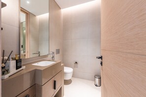 Bathtub, hair dryer, towels