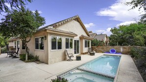 A house with a swimming pool, a patio with outdoor furniture, and a garden. - Foothills Southwest Sanctuary w/ Pool & Views (Tucson)