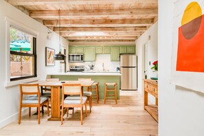 Enjoy meals in the kitchen with a dining area and modern appliances.
