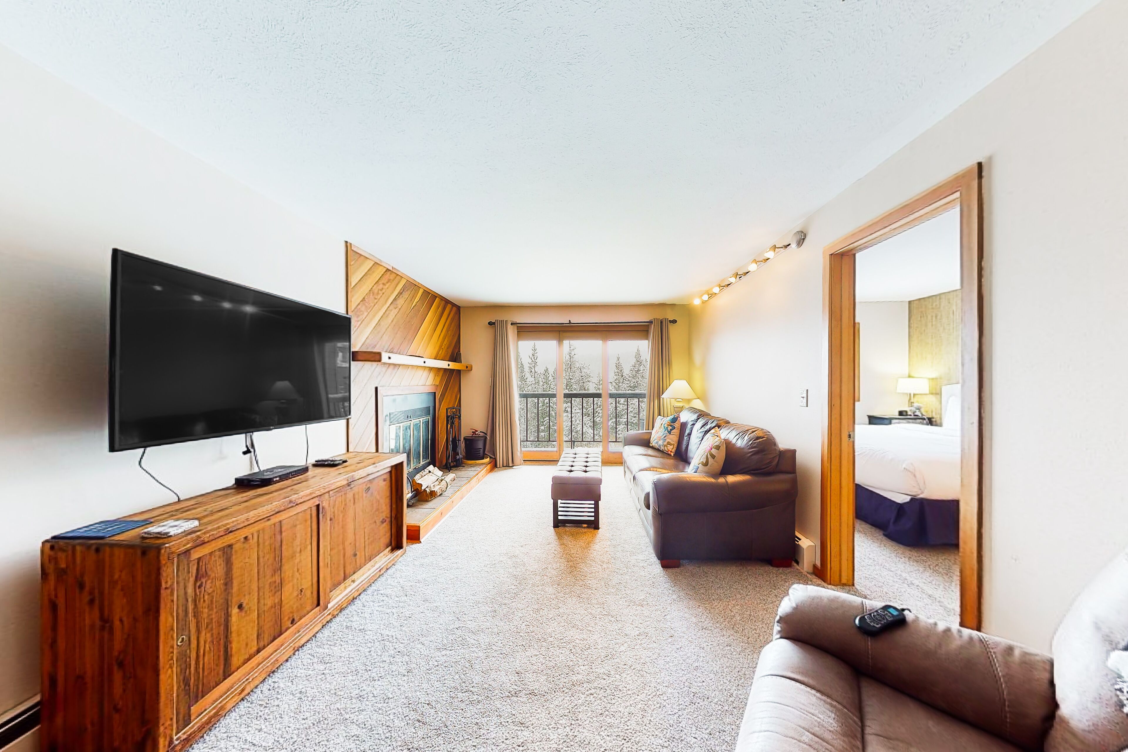 Mountain-view home with fireplace, hot tub, heated indoor pool, and washer/dryer