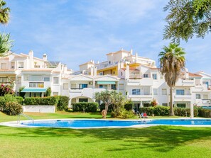 Relax by the large pool surrounded by lush gardens and enjoy the expansive outdoor spaces.