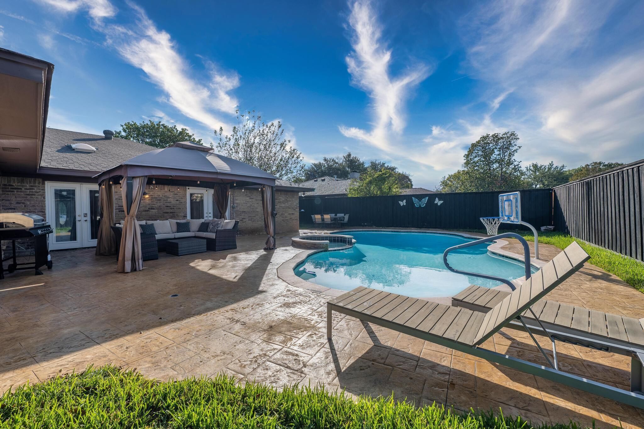 Master bedroom overlooking heated pool & hot tub
