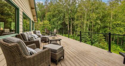 Lakefront Anchorage home with fireplaces, jetted tub & private dock