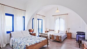 A bedroom with two wooden beds, a desk, and a chair. - Villa Mandola Rosa in Poli Crysochous (Polis)