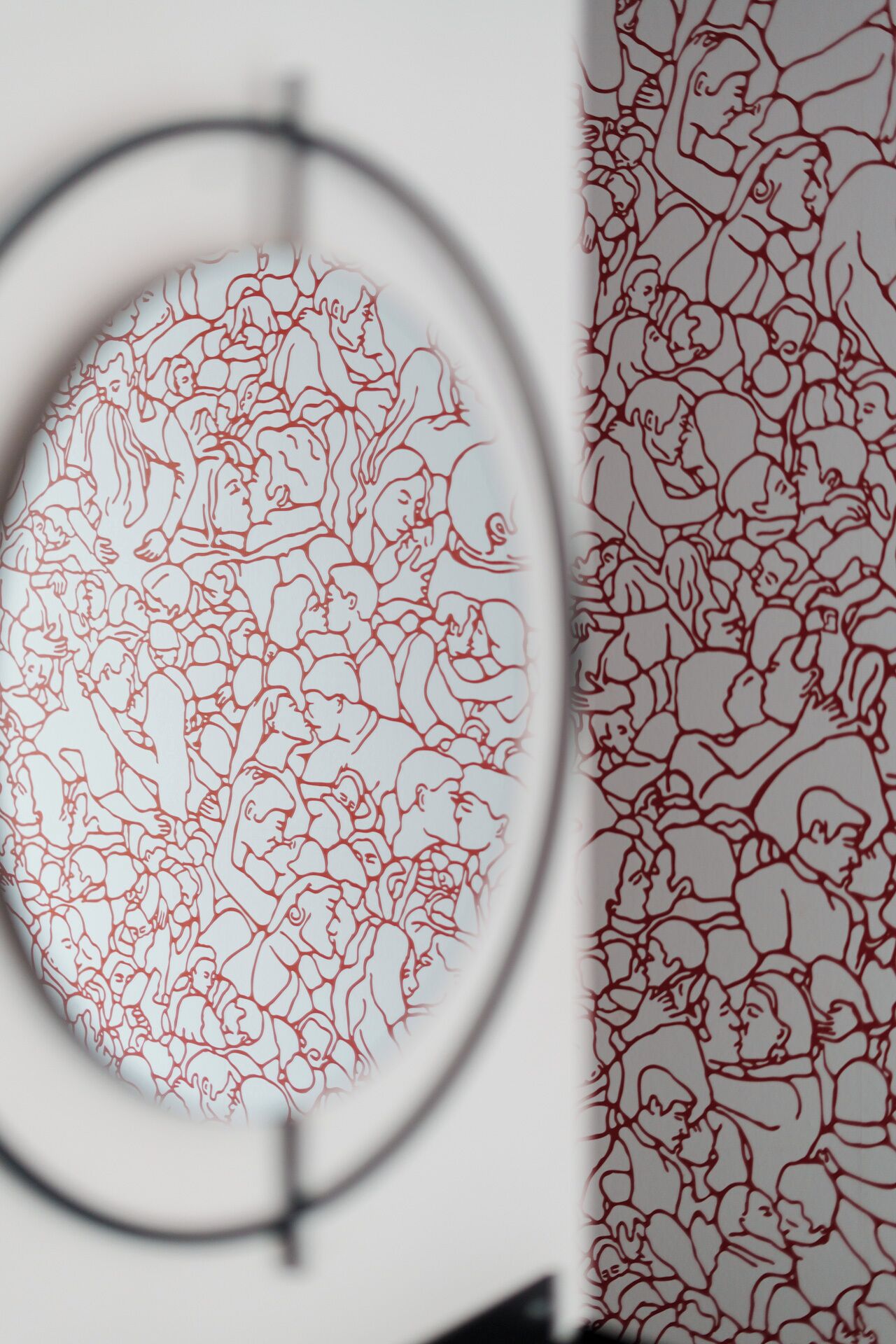A circular view of a room with a patterned wall.